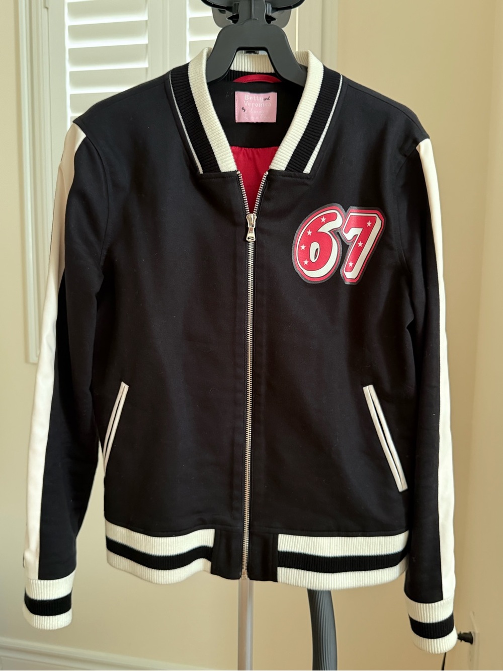 Bettina Liano Black Jacket with White Stripes and Red Patch